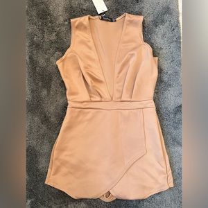 NEW WITH TAGS. Boohoo camel/tan skort romper with plunging neckline.